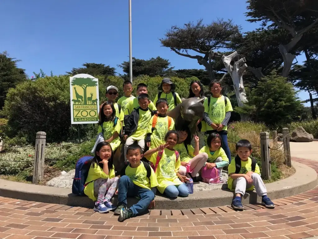 Everyday Mandarin summer campers in matching shirts on a group field trip